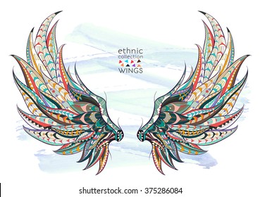 Patterned wings on the grunge background. African / indian / totem / tattoo design. It may be used for design of a t-shirt, bag, postcard, a poster and so on.  