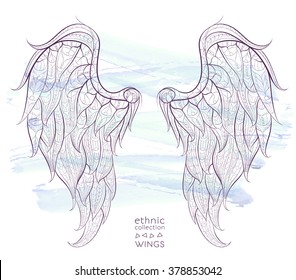 Patterned wings on the grunge background. African / indian / totem / tattoo design. It may be used for design of a t-shirt, bag, postcard, a poster and so on.  