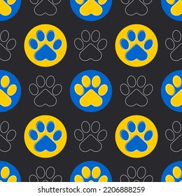 Paw of a cat or dog. Blue and yellow paws of animals on a black background. Cute seamless pattern. Vector.