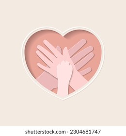 Paw of dog stacking on hands of family members in heart shaped paper cutting art