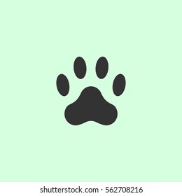 Paw icon flat. Grey vector symbol on green background