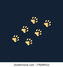 Paw icon flat. Simple gold pictogram on dark background. Vector illustration symbol