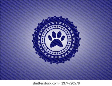 paw icon inside badge with jean texture