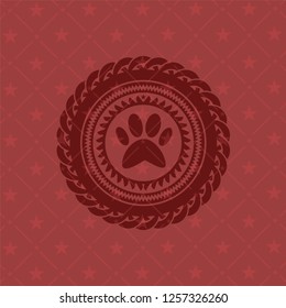 paw icon inside badge with red background