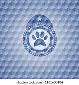 paw icon inside blue emblem with geometric pattern.