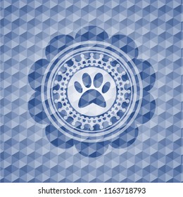 paw icon inside blue emblem with geometric background.