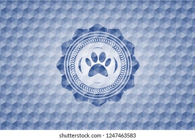 paw icon inside blue hexagon badge.