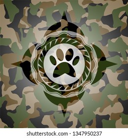 paw icon inside camouflaged emblem