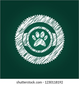 paw icon inside chalkboard emblem written on a blackboard