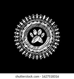 paw icon inside chalkboard emblem written on a blackboard