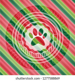 paw icon inside christmas badge background.