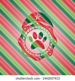 paw icon inside christmas badge.