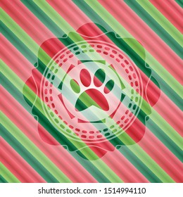 paw icon inside christmas colors badge.