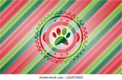 paw icon inside christmas emblem background.