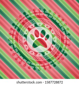 paw icon inside christmas emblem background.