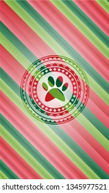 paw icon inside christmas style emblem.