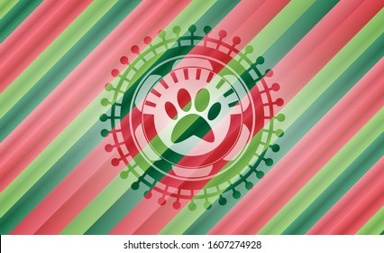 paw icon inside christmas style emblem.