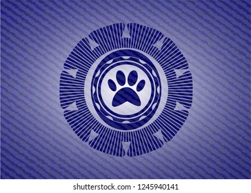 paw icon inside denim background
