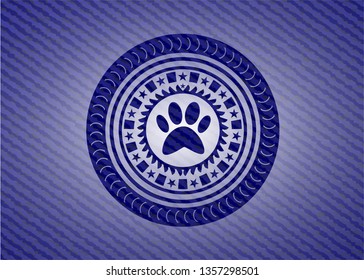 paw icon inside denim background