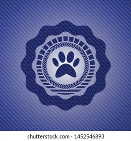 paw icon inside emblem with denim high quality background