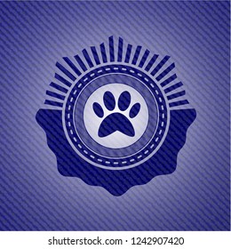 paw icon inside emblem with jean texture
