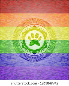 paw icon inside emblem on mosaic background with the colors of the LGBT flag