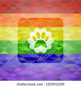 paw icon inside emblem on mosaic background with the colors of the LGBT flag