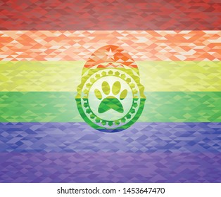 paw icon inside emblem on mosaic background with the colors of the LGBT flag