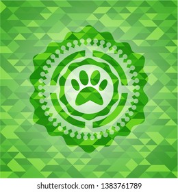 paw icon inside green emblem with mosaic background