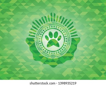 paw icon inside green emblem. Mosaic background