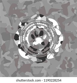 paw icon inside grey camo texture