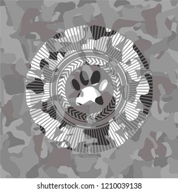 paw icon inside grey camo emblem