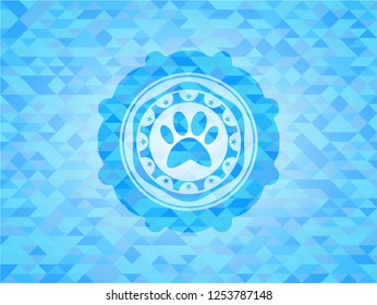 paw icon inside light blue emblem with triangle mosaic background