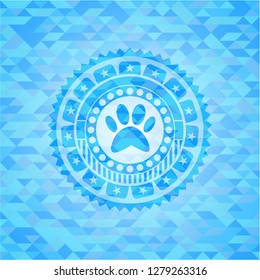 paw icon inside light blue mosaic emblem