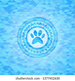 paw icon inside light blue emblem with triangle mosaic background