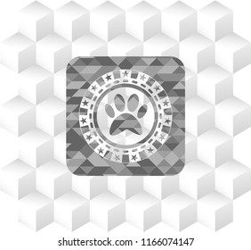paw icon inside realistic grey emblem with geometric cube white background