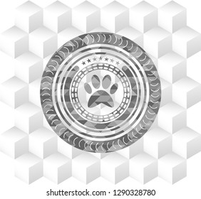 paw icon inside realistic grey emblem with cube white background
