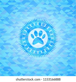 paw icon inside realistic light blue emblem. Mosaic background