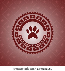 paw icon inside red emblem