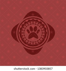 paw icon inside red emblem