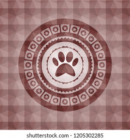 paw icon inside red seamless geometric badge.