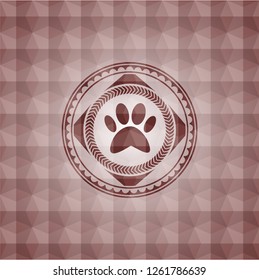 paw icon inside red seamless geometric emblem.