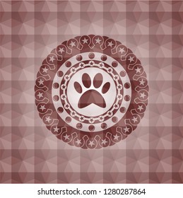 paw icon inside red seamless badge with geometric pattern background.