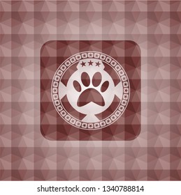 paw icon inside red seamless emblem with geometric pattern.