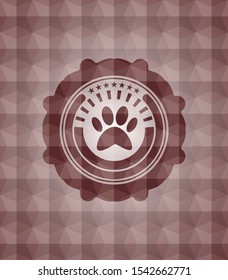 paw icon inside red seamless emblem with geometric pattern.
