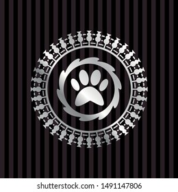 paw icon inside silver badge or emblem