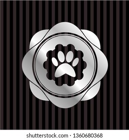 paw icon inside silver emblem or badge