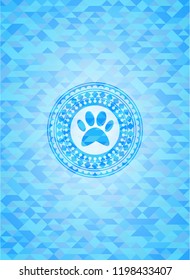 paw icon inside sky blue emblem with mosaic ecological style background