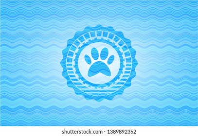 paw icon inside sky blue water badge.