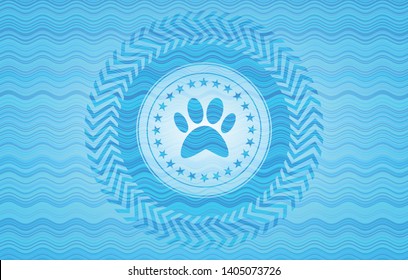 paw icon inside sky blue water style badge.